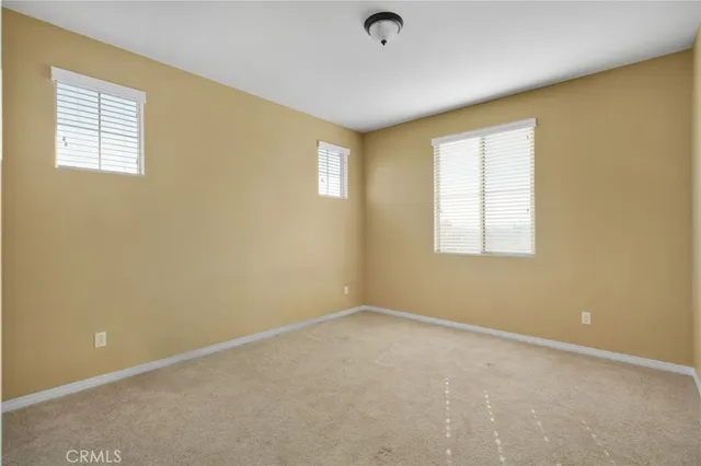 a en suite bathroom with a sink a toilet and a mirror