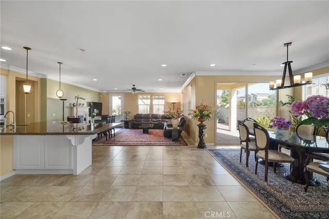a lobby with furniture and a potted plant