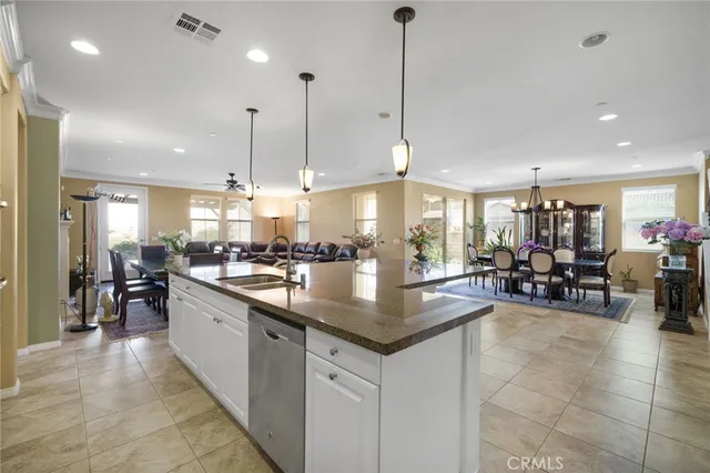 a kitchen with lots of counter space dining table and chairs
