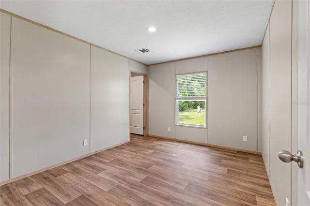 a bathroom with a sink toilet a mirror and shower
