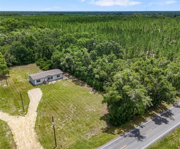 a front view of a house with yard