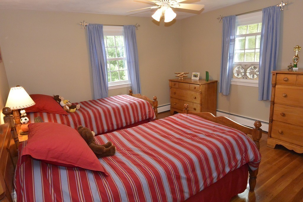 6 Stonybrook Road Medfield, MA 02052 - Photo 16 of 25 a bedroom with two beds and a window