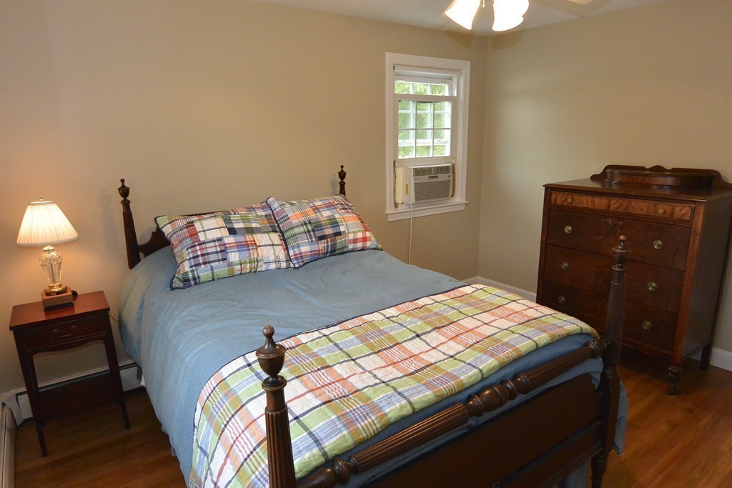 6 Stonybrook Road Medfield, MA 02052 - Photo 17 of 25 a bedroom with a bed and a window