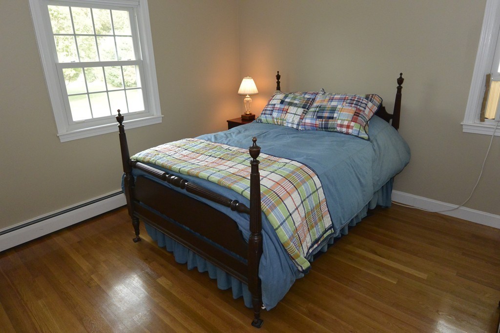 6 Stonybrook Road Medfield, MA 02052 - Photo 18 of 25 a bedroom with bed and wooden floor