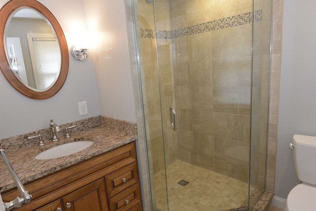 6 Stonybrook Road Medfield, MA 02052 - Photo 23 of 25 a bathroom with a granite countertop sink toilet and shower