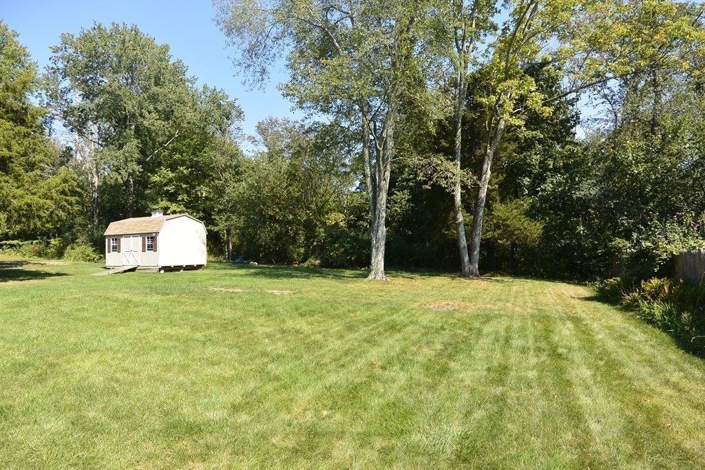 6 Stonybrook Road Medfield, MA 02052 - Photo 25 of 25 a house with trees in the background