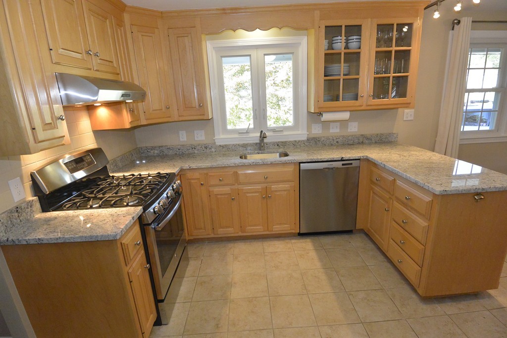 6 Stonybrook Road Medfield, MA 02052 - Photo 4 of 25 a kitchen with a stove a sink dishwasher and a refrigerator