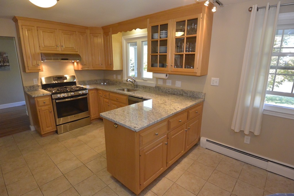 6 Stonybrook Road Medfield, MA 02052 - Photo 5 of 25 a kitchen with granite countertop a sink and a stove