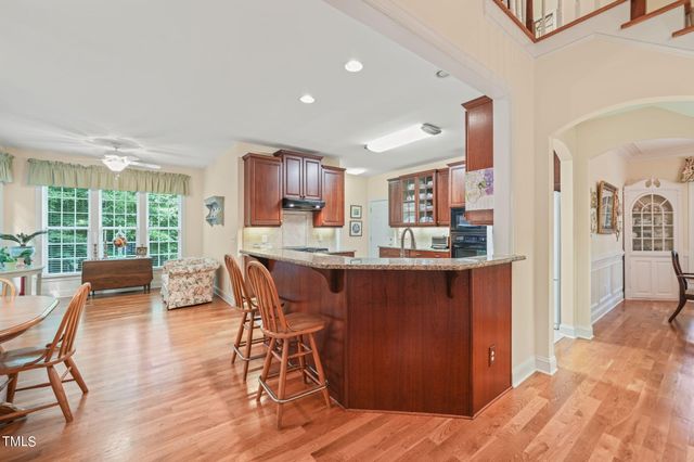 a view of park with a wooden fence