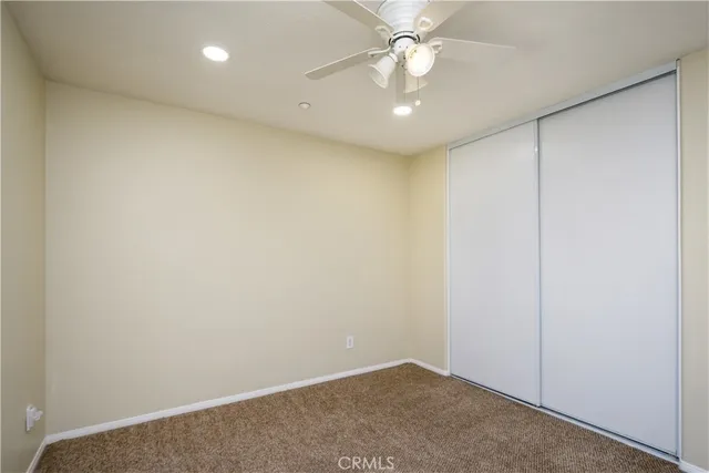 a view of a small space with window and closet