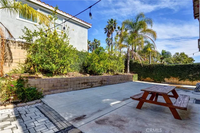 an aerial view of residential houses with a city view
