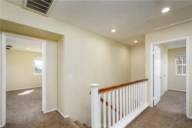 a view of empty room with windows