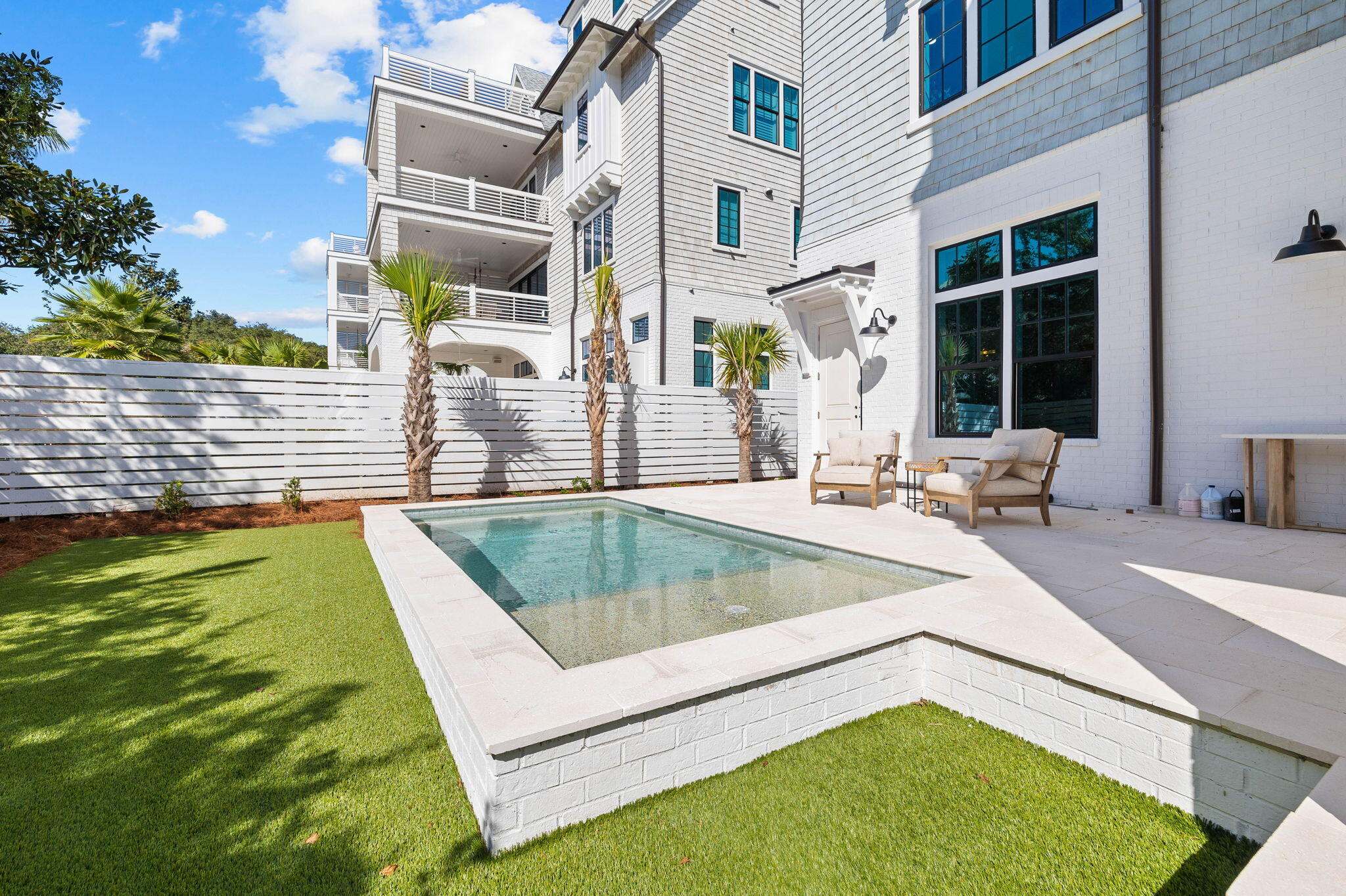 27 Grand Inlet Inlet Beach, FL 32461 - Photo 14 of 65 a view of a swimming pool with a chair and tables in the patio