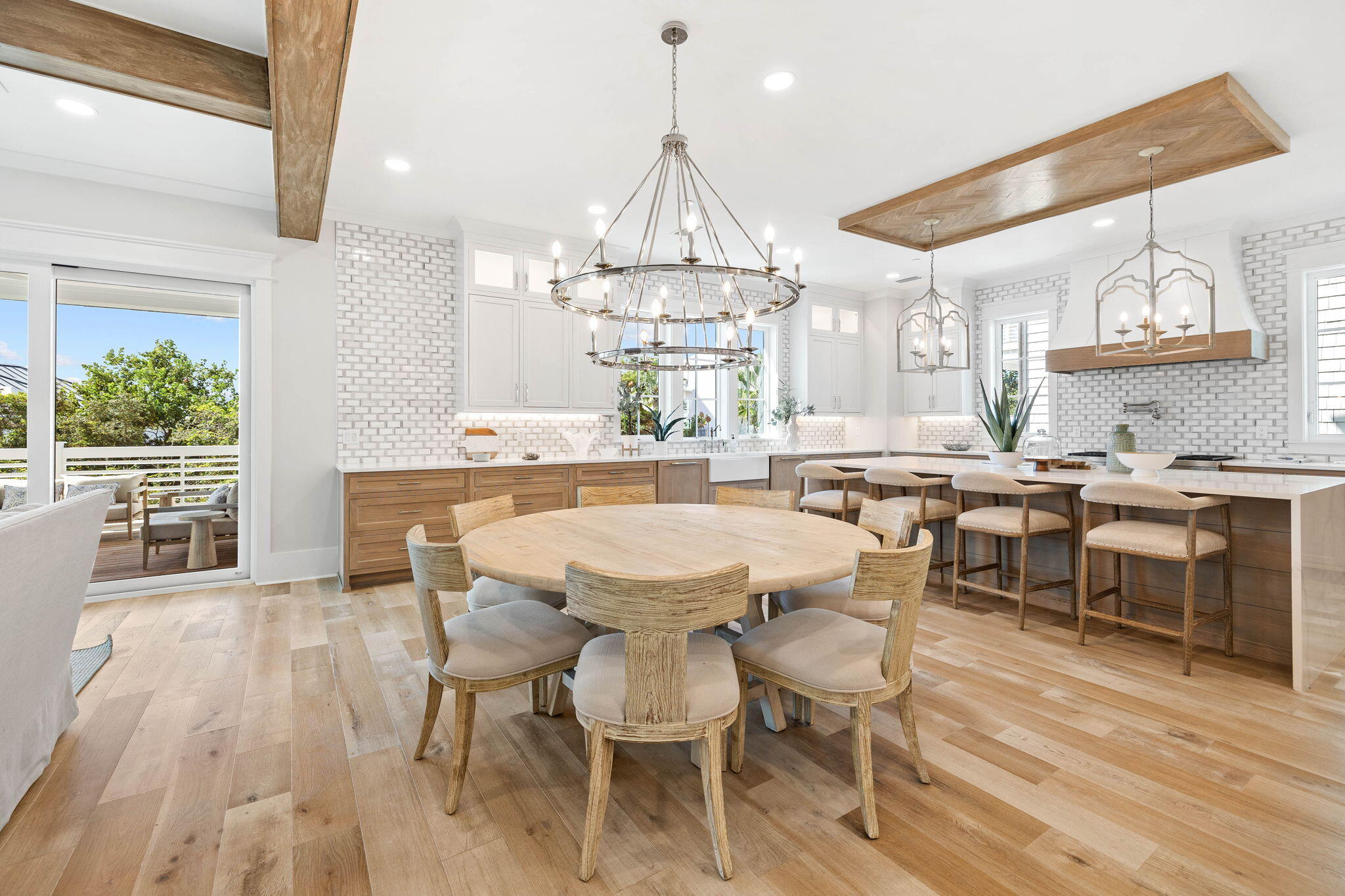 27 Grand Inlet Inlet Beach, FL 32461 - Photo 29 of 65 a dining room with wooden floor a chandelier a wooden table and chairs