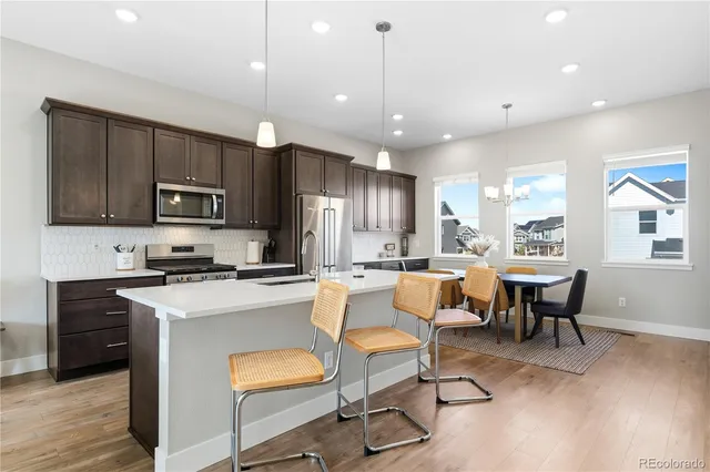 a kitchen with a stove and a microwave