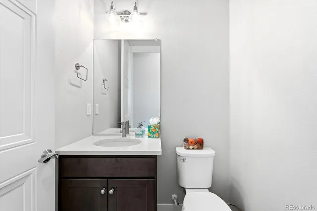 a bathroom with double sink and a mirror