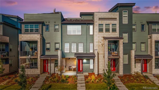 a view of a hallway with wooden floor and entryway