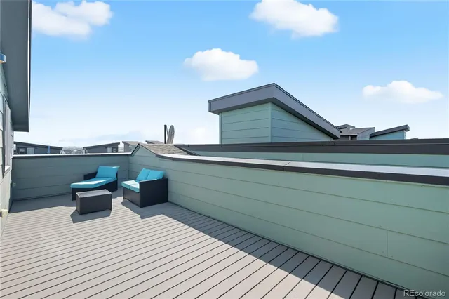 a balcony view with a seating space