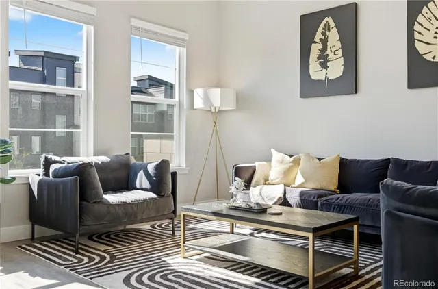 a kitchen with stainless steel appliances a stove a sink a microwave a refrigerator and cabinets