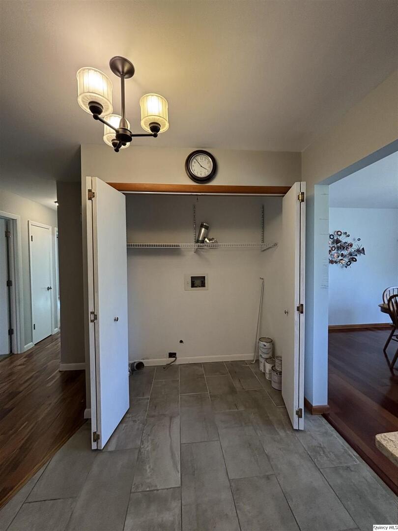 802 West Main Street La Harpe, IL 61450 - Photo 13 of 25 wooden floor in an empty room