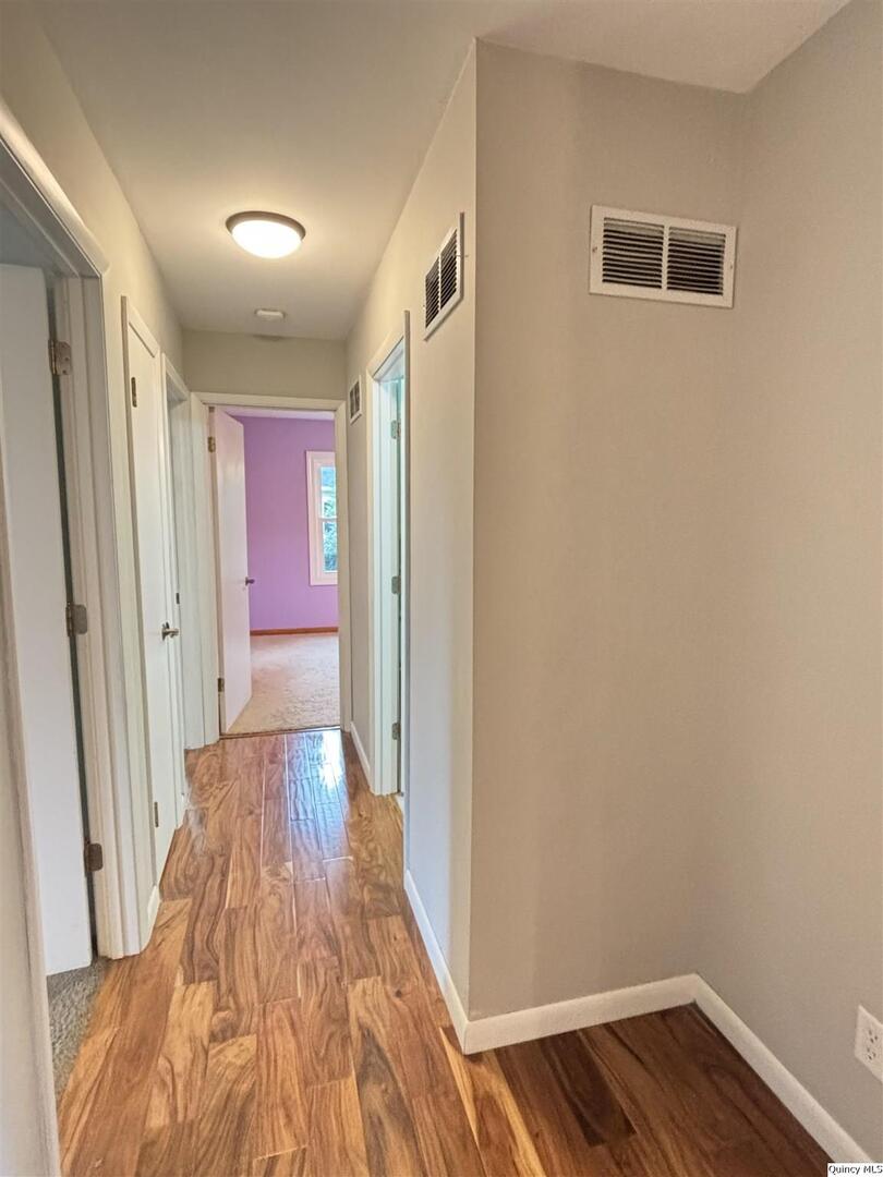 802 West Main Street La Harpe, IL 61450 - Photo 17 of 25 a view of hallway with wooden floor