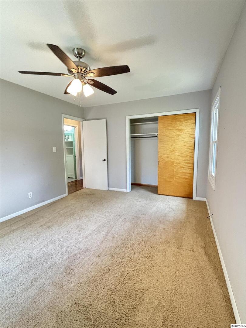 802 West Main Street La Harpe, IL 61450 - Photo 20 of 25 a view of an empty room and window