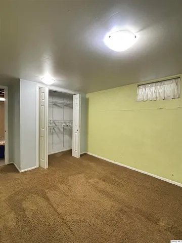 an empty room with fan