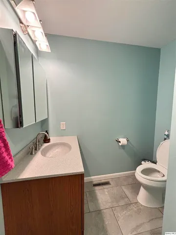 a bathroom with a sink and a toilet