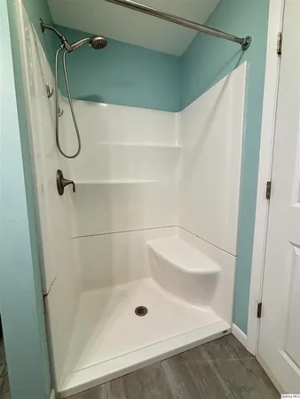 a bathroom with a bath tub