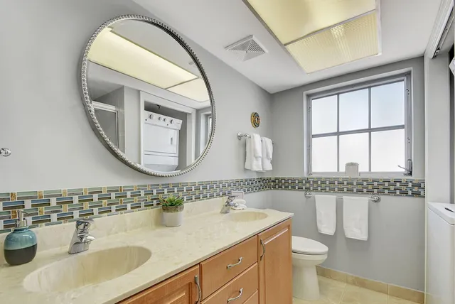 a balcony with furniture and floor to ceiling window