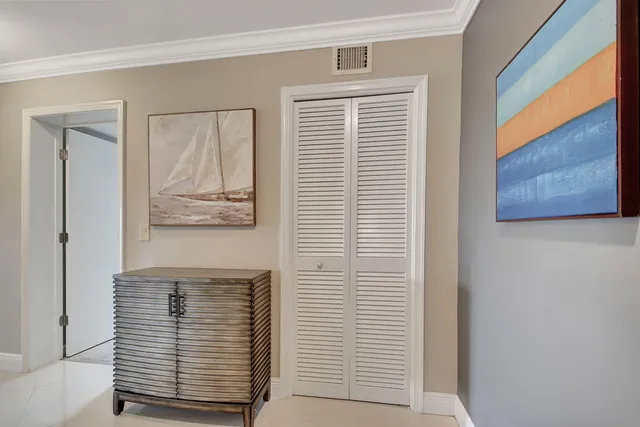 a kitchen with stainless steel appliances a stove a microwave and cabinets