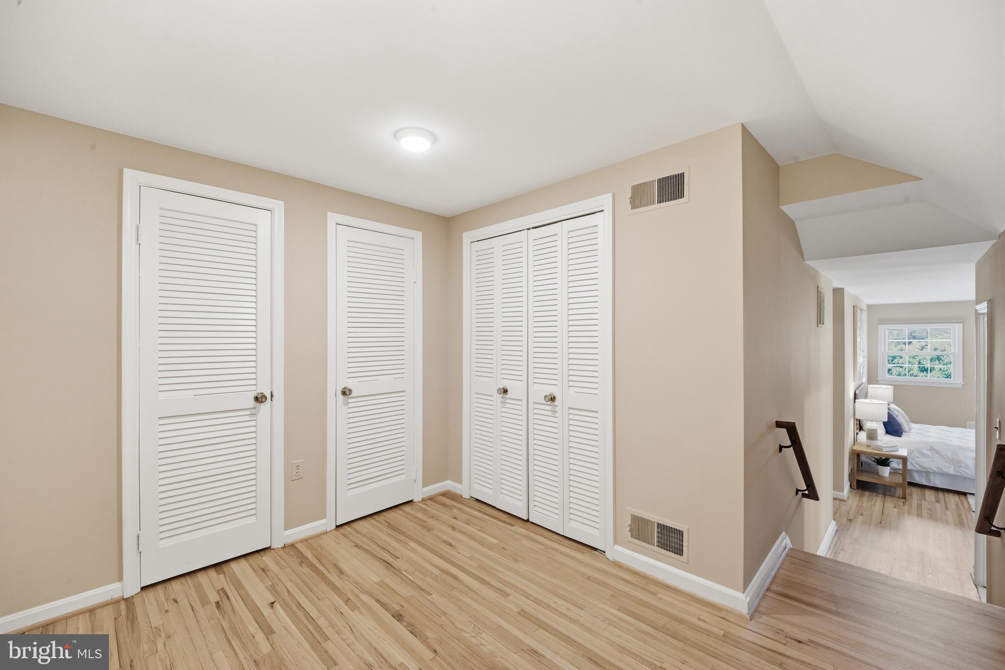 13309 Old Forge Road Silver Spring, MD 20904 - Photo 32 of 52 a view of a livingroom with wooden floor and bedroom