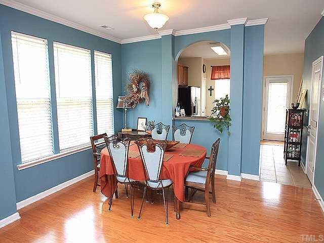 5315 Silver Moon Lane Raleigh, NC 27606 - Photo 12 of 12 Wonderful floorplan with 9-foot smooth ceilings, lots of windows, great flow. Separate dining room complete with hardwoods, crown molding and arched pass through to kitchen.