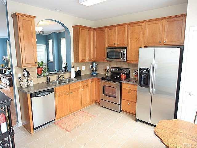 5315 Silver Moon Lane Raleigh, NC 27606 - Photo 3 of 12 This large kitchen has all the builder upgrades...42-inch cabinets, solid surface/corian countertops with tile backsplash, all stainless appliances including smooth top range and built in microwave oven, pantry and tile floors.