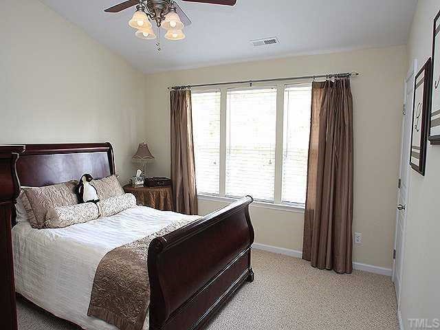 5315 Silver Moon Lane Raleigh, NC 27606 - Photo 5 of 12 Roomy master suite boasts vaulted ceiling with upgraded fan, double walk-in closets and berber carpet.
