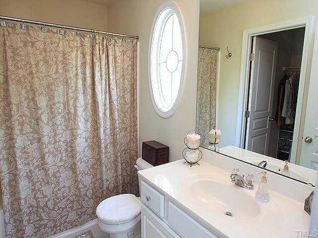 5315 Silver Moon Lane Raleigh, NC 27606 - Photo 6 of 12 Upgraded master bath features tile floors, adult-height dual sink vanity, garden tub and spacious walk-in closet.