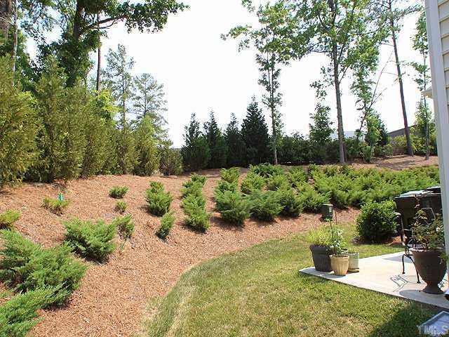 5315 Silver Moon Lane Raleigh, NC 27606 - Photo 8 of 12 Benefits of an end-unit include a nice grassy area for outdoor entertaining. Really nice privacy here.