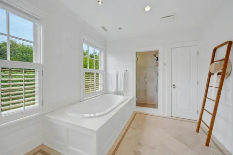 a bathroom with a sink double vanity and a shower
