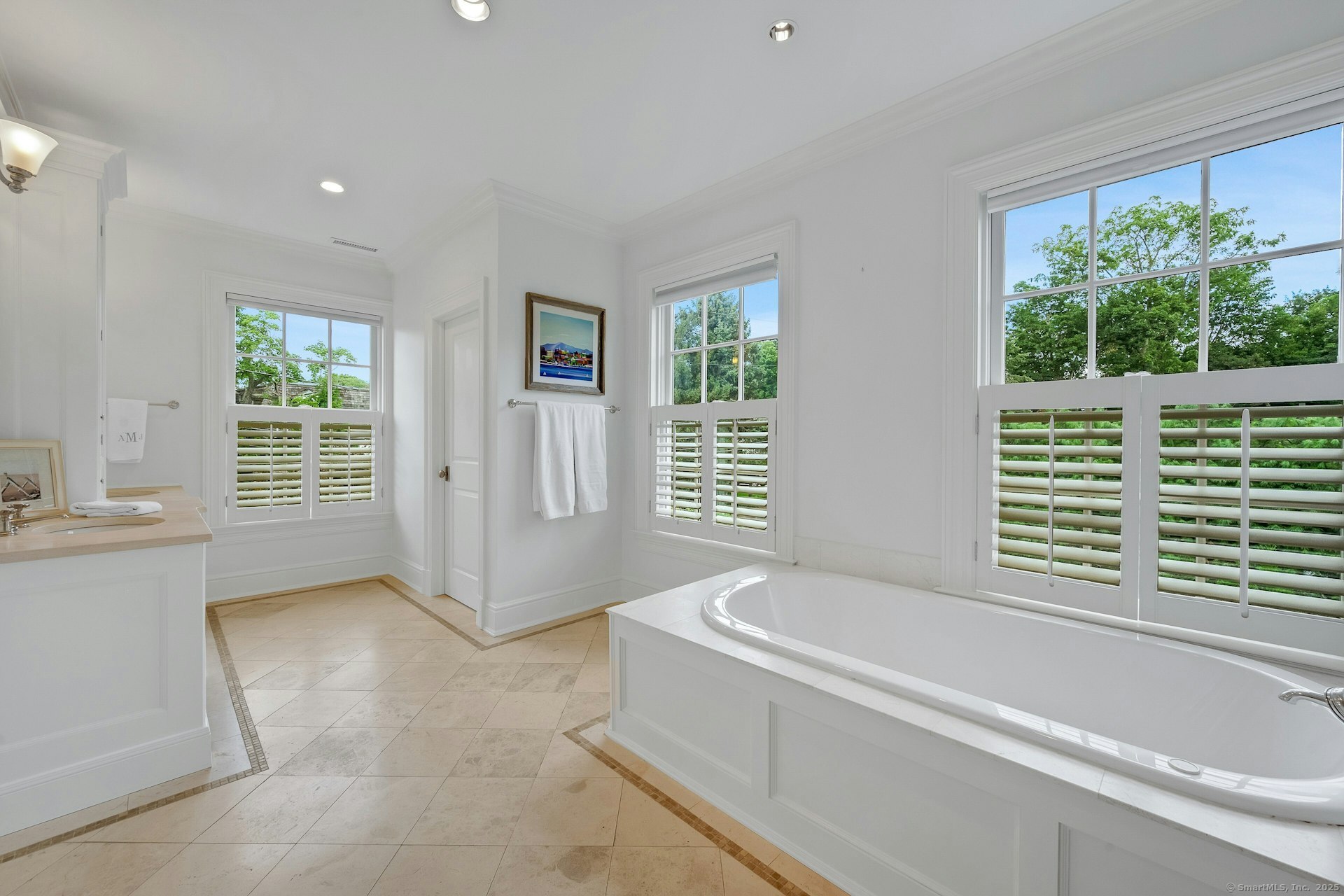 166 Rowayton Avenue, Unit 2 Norwalk, CT 06853 - Photo 25 of 40 a bathroom with sink bathtub and window
