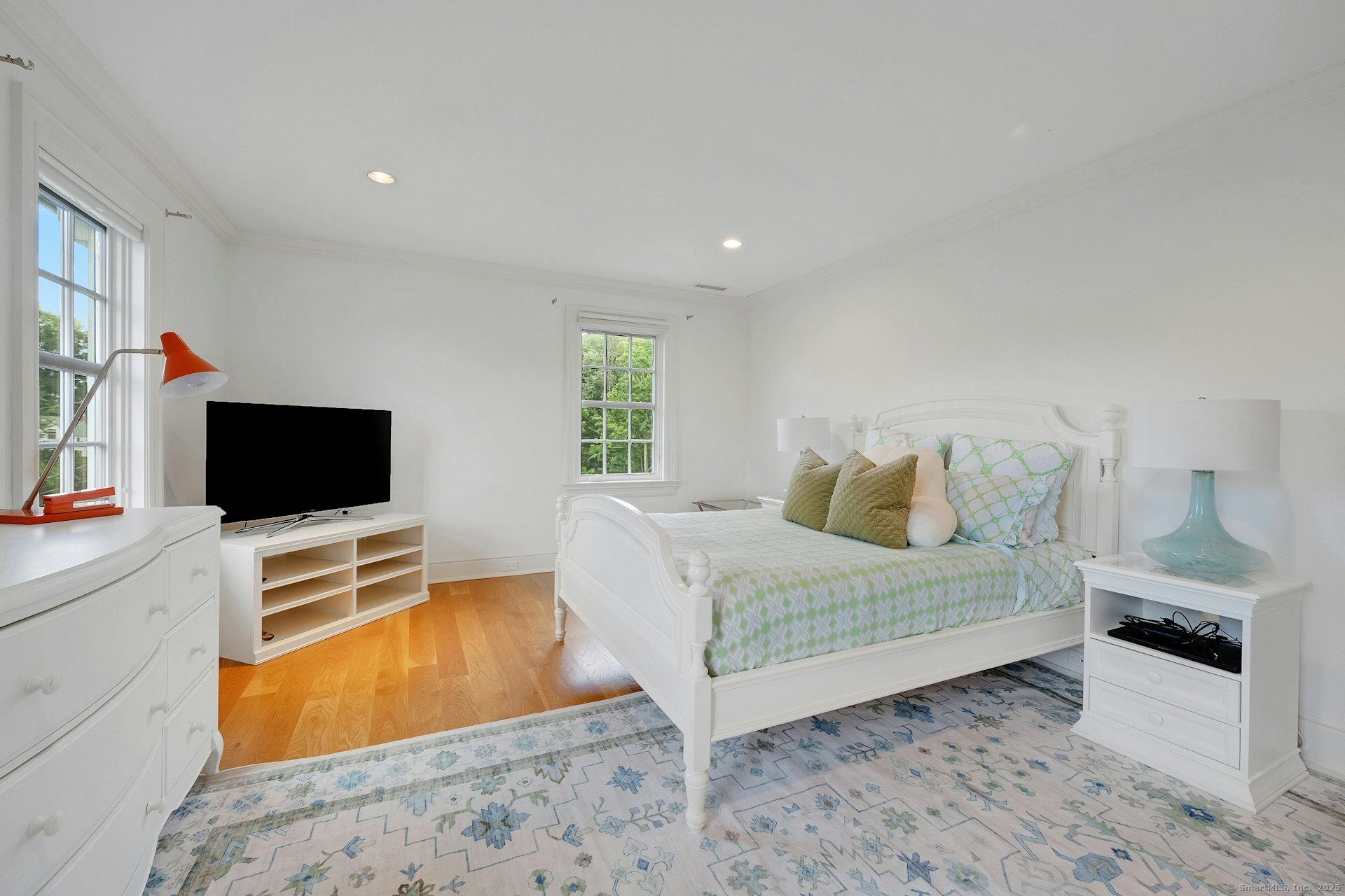 166 Rowayton Avenue, Unit 2 Norwalk, CT 06853 - Photo 29 of 40 a bedroom with a bed and a flat screen tv