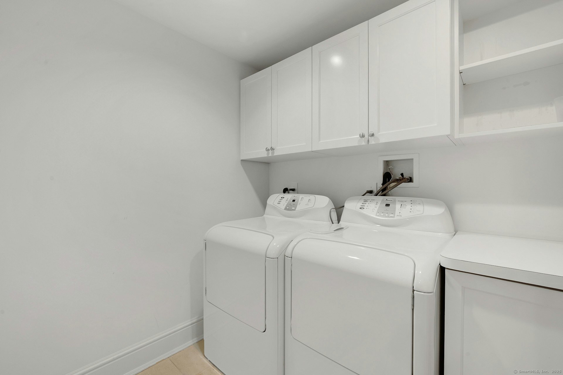 166 Rowayton Avenue, Unit 2 Norwalk, CT 06853 - Photo 32 of 40 a utility room with dryer and washer