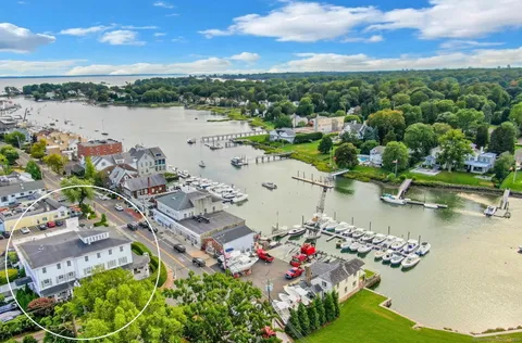 an aerial view of a house with lake view