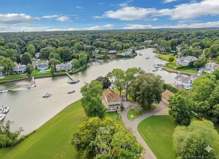 an aerial view of lake residential houses with outdoor space and river