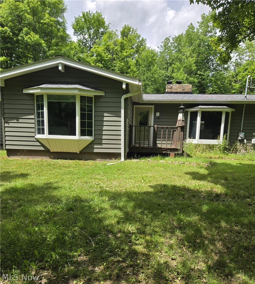 15610 Claridon Troy Road Burton, OH 44021 - Photo 2 of 22 two large bay windows adorn the south side, looking into the woods