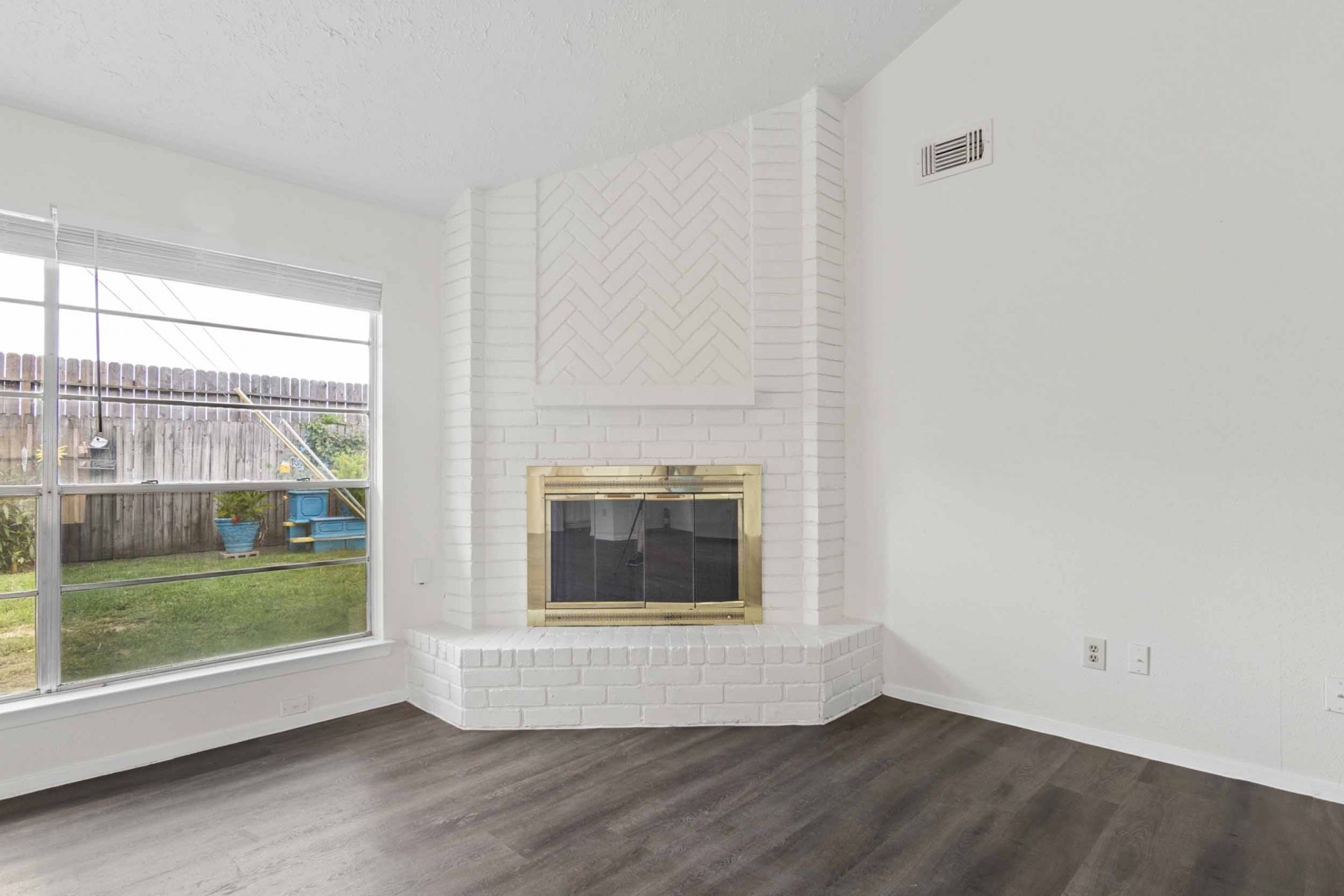 10411 Rabbit Oak Drive Houston, TX 77065 - Photo 9 of 22 Natural light floods in through a large window overlooking a fenced backyard.