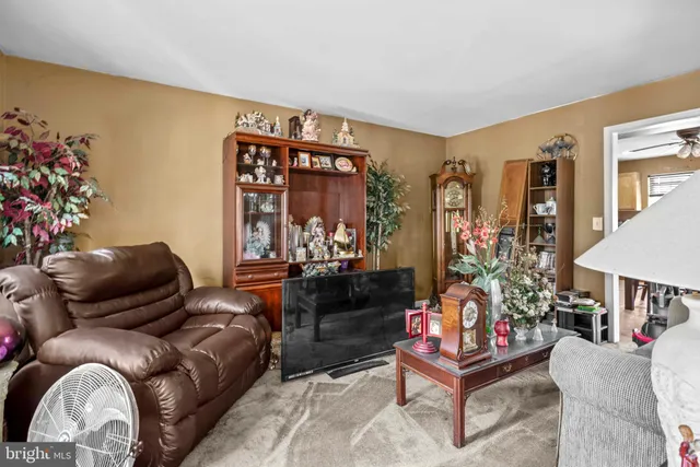 a bedroom with a bed gym equipment and a large window