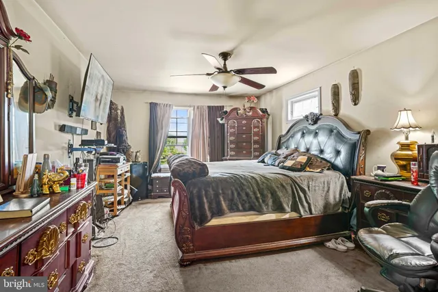 a bathroom with a bathtub sink vanity and mirror