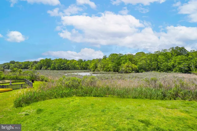 an aerial view of a house with a lake view