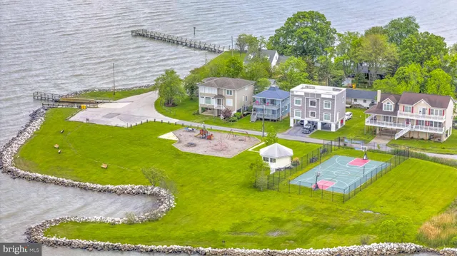 a view of a house with a yard potted plants
