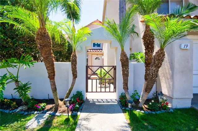a backyard of a house with outdoor seating